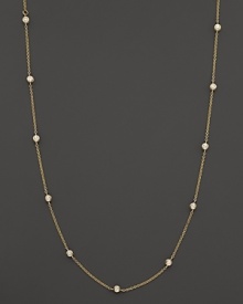 Diamond stations shine on an elegant yellow gold necklace.