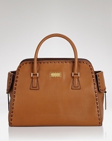 Bring a bright statement with Michael Kors' shapely leather satchel on your arm. With gold tone hardware and a vibrant hue, the bag is a cool color-pop with laid-back looks.