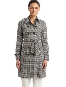 Youthful yet completely fashionable, this gingham design has a classic double breasted silhouette and tie-belt waist.Point collar with hook-and-eye closure Triangular button tab at collar Button down storm flap Shoulder epaulettes Long sleeves with belted cuffs Buckled belt at waist Dual vertical flap pockets Fully lined About 36 from shoulder to hem Rayon Dry clean Made in Italy