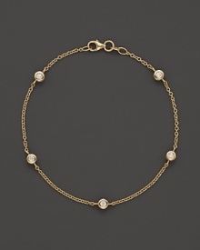 Diamond stations on a fine yellow gold chain bracelet.