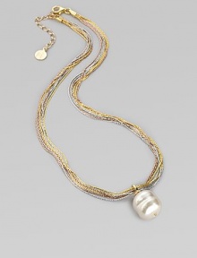 A single white baroque pearl hangs gracefully from delicate chains of 18k rose and yellow gold vermeil, and sterling silver. 16mm white organic man-made pearl Length, about 16 with 2 extender Lobster clasp Made in Spain