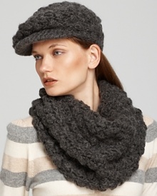 Add a textural element to your winter wardrobe with this chic popcorn knit newsboy cap from Michael Kors.