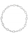 Traditional yet trendy! A link design makes Eliot Danori's collar necklace classically chic, while sparkling crystals give it a modern makeover. Set in silver tone mixed metal, it's the best of both worlds. Approximate length: 16 inches.