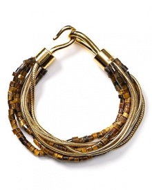 Follow your feline instincts and flaunt MICHAEL Michael Kors' tiger's eye and chain bracelet--the fierce wristpiece lends exotic flair to staple tees or femme blouses.