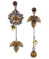 The tropics don't have to be so far away. Betsey Johnson's mismatch flower and leaf drop earrings feature soothing topaz tones with glass pearls and crystals providing luster. Crafted from gold-tone mixed metal. Approximate drop: 3 inches.