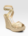 Gold-finished suede gives this classic style a hint of glamour. Wedge heel, 4¾ (120mm) Platform, 1½ (40mm) Compares to 3¼ heel (80mm) Open toe Crisscross straps Adjustable ankle strap Leather lining Rubber sole Made in ItalyOUR FIT MODEL RECOMMENDS ordering true whole size; ½ sizes should order the next whole size up.