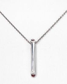 Add cool-girl cred to your jewel box with Elizabeth and James' garnet-encrusted pendant. Wear this silvery style with a silky blouse, layering other striking styles to work an eclectic edge.