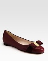 Glossy patent leather classic is a favorite with signature grosgrain bow at the toe. Grosgrain bow and logo hardware at toe Leather lining and sole Made in ItalyOUR FIT MODEL RECOMMENDS ordering true size.