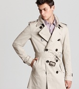 An undisputed classic from Burberry, the double-breasted trench coat brings understated style to blustery days.