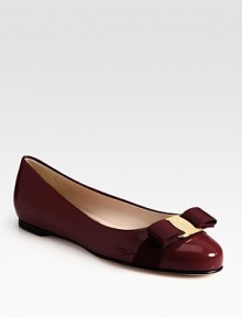 Glossy patent leather classic is a favorite with signature grosgrain bow at the toe. Grosgrain bow and logo hardware at toe Leather lining and sole Made in ItalyOUR FIT MODEL RECOMMENDS ordering true size.