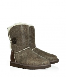 Stylishly distressed and undeniably cozy, these vintage-inspired shearling boots from UGG Australia lend comfort and style to your cold weather look - Round toe, rugged rubber sole, exposed seams, side button detail, contrasting back suede panel, cozy shearling lining, ankle-length , distressed leather - Pair with skinny jeans, an oversized cashmere sweater, and a down jacket or wool cape