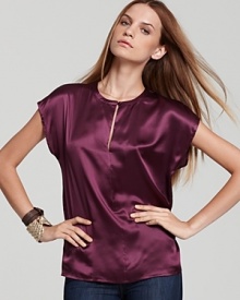 In lush silk-satin, this shimmery Pippa top is a holiday must-have, flaunting an elegant keyhole opening at the neckline and femme cap sleeves. Pair berry-hued style with skinny jeans or get dressier and opt for sleek tux pants.