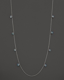 Inspired by Zen philosophy, this intricately detailed sterling silver necklace from Paul Morelli softly jingles with eight meditation bells and cabochons of blue topaz.