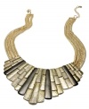 Dress like an Egyptian. This regal necklace from Alfani commands attention with a bib accent with subtle hematite hues. Strung from a multi-chain with closure. Crafted in gold tone mixed metal. Approximate length: 18 inches + 3-inch extender. Approximate drop: 2-3/4 inches.