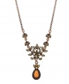 Retro romance and vintage glamour, by 2028. Delicate crystal-accented leaves lead to a stunning smoky topaz-colored teardrop stone. Necklace crafted in burnished coppertone mixed metal. Approximate length: 16 inches + 3-inch extender. Approximate drop: 1-7/8 inches.