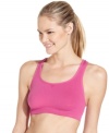 Energize your workout routine in Ideology's bright pink sports bra. Crisscross straps at the back lend comfort and support.