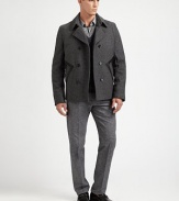 A double-breasted outerwear silhouette crafted in a superior wool blend, featuring leather pocket detailing for a uniquely tailored finish.Button-frontWaist slash pocketsFully linedAbout 27 from shoulder to hem80% wool/20% polyamideDry cleanImported