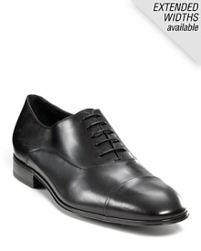 Classic cap toe oxfords, crafted from fine leather. Lace-up leather upper. Leather lined and sole. Slight stacked heel. Signature gancini embossed on heel.