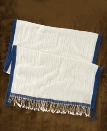 A bold border stripe and whimsical fringed ends give modern definition to Denim & Supply Ralph Lauren's whisper-thin, airy cotton scarf.