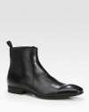 A sleek and modern chelsea boot design constructed in luxurious leather with size-zip and ankle pull-tab detail.Leather upperLeather liningPadded insoleRubber soleImported