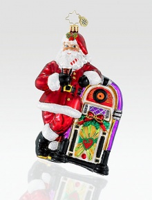 Cut from vibrant European glass, a jolly Santa kicks back while listening to some timeless holiday tunes. Hand-blownHand-painted5½ tallMade in Poland