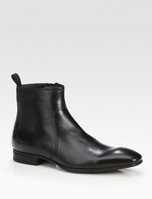 A sleek and modern chelsea boot design constructed in luxurious leather with size-zip and ankle pull-tab detail.Leather upperLeather liningPadded insoleRubber soleImported