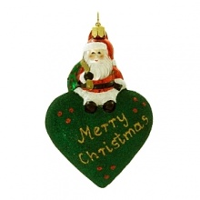 A little Santa sits atop a glittered puffed heart to wish you a Merry Christmas.