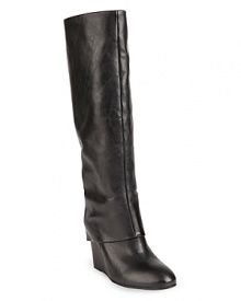 These STEVEN BY STEVE MADDEN wedge boots are at the height of fashion, with long, pants-friendly foldover cuffs that create a sleek look.