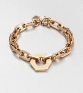 A logo accented nut charm sits on a narrow, chain link design. Rose goldtone brassLength, about 7.6Charm size, about .75Spring ring closureImported 