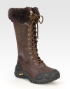 Tall rustic leather and suede design with a lace-up front, shearling cuff and sporty rubber sole for added traction. Rubber heel, 1 (25mm)Shaft, 13Leg circumference, 17Leather and suede upperShearling liningRubber solePadded insoleImported