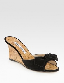 Natural cork wedge with a suede upper and bow adornment. Cork-covered wedge, 2¾ (70mm)Suede and natural cork upperBuffed leather soleMade in ItalyOUR FIT MODEL RECOMMENDS ordering one half size up as this style runs small. 