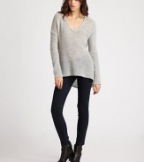 A featherweight pullover tailored with a modern dropped shoulder and asymmetrical hemline.V necklineDropped shouldersLong sleeves50% alpaca/50% merino woolDry cleanImported