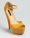 A raffia-covered sole lends textural appeal to Rachel Zoe's Bardot sandals, an open toe style with vintage appeal in vibrant yellow.