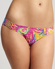 A brightly printed swim bottom with chic hardware detail at hips.