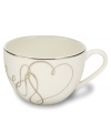 Sweet yet sophisticated, a loopy heart design sweeps across this porcelain teacup from Mikasa. Complete with a sparkling platinum rim, this flirty ribbon pattern captivates everyone at your dinner table.