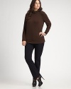 An essential style to wear layered or alone in a soft jersey knit.PulloverSoft scrunched turtleneckLong sleevesAbout 25 from shoulder to hem94% viscose/6% elastaneHand washImported of Italian fabric