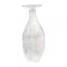 Handmade and inspired by the maestro artisan's family dinnerware, this distressed white vase has an heirloom feel that creates a rustically elegant display.