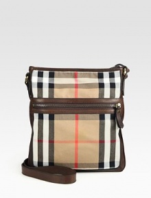 Iconic check printed cotton, in slim, crossbody design, with rich leather trim.Zip closureExterior, interior zip pockets83% cotton/17% polyurethane11W x 12½HMade in Italy