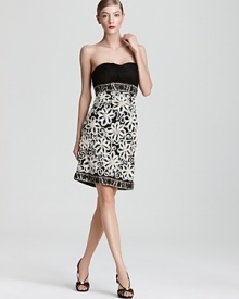 An intricately pleated bodice tops off a richly embellished skirt on this Sue Wong strapless dress.