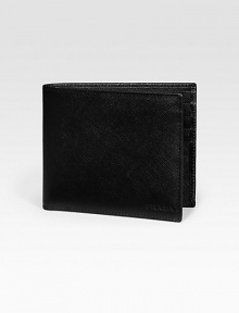 Saffiano leather wallet opens to eight credit card slots and two billfold compartments. Embossed Prada logo detail 4¼W X 3¾H Made in Italy 