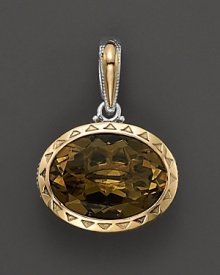 Sterling silver and 18K yellow gold frame a faceted olive quartz. By Tacori.