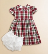 Adorned with a festive plaid print and matching tie, this gorgeous cotton frock with matching bloomers will make your little girl feel like a sugarplum fairy.Peter Pan collarShort puff sleevesBack buttonsWaistband with ribbon tieFull skirtFully linedCottonDry cleanImported Please note: Number of buttons may vary depending on size ordered. 