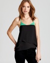 Update your summer collection with this BCBGMAXAZRIA top, enlivened by a vibrant lash of color at the neckline.