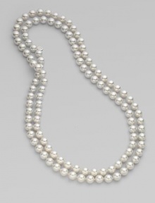 An extra long strand of round, iridescent pearls that can be worn wrapped around the neck for a classic style statement.White, organic man-made pearls Length, about 48 Made in Spain 