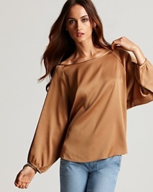 Luxury abounds with this rich stretch silk Vince metallic top, the one-step solution to dressing up light-wash denim when subtle glamour is your goal. Elegant details elevate the look, which doubles as the perfect fall style.