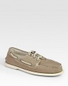 Classically constructed in stretchy canvas, this rugged staple has suede trim and signature laces. Rubber soleImported