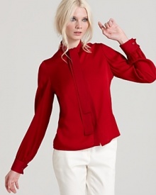 Offset minimalist separates with the fiery hue and fabulous style of this Rachel Zoe blouse, flaunting a tie neckline and pleated cuffs for a touch of femininity.