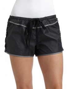 THE LOOKNarrow elastic waistband with drawstringContrast pipingLace-up sidesBack zip pocketTHE FITRise, about 9Inseam, about 1½THE MATERIALPolyester/nylonFully linedCARE & ORIGINHand washMade in USAModel shown is 5'10 (172½cm) wearing US size Small. 