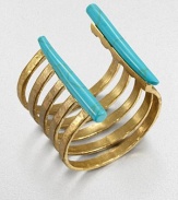 From the Horn Collection. Simply striking, this open cuff of golden bands with an antiqued finish is edged with baguette-shaped natural stones with the veiny look of turquoise.Natural stone18k goldplatedDiameter, about 2.25Width, about 2.75Made in USA