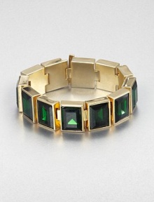 From the Cocktail Collection. Bold faceted stones of rich emerald-colored glass sit all in a row in this striking design of polished goldtone.GlassGoldtoneLength, about 7Width, about .75Bar claspImported